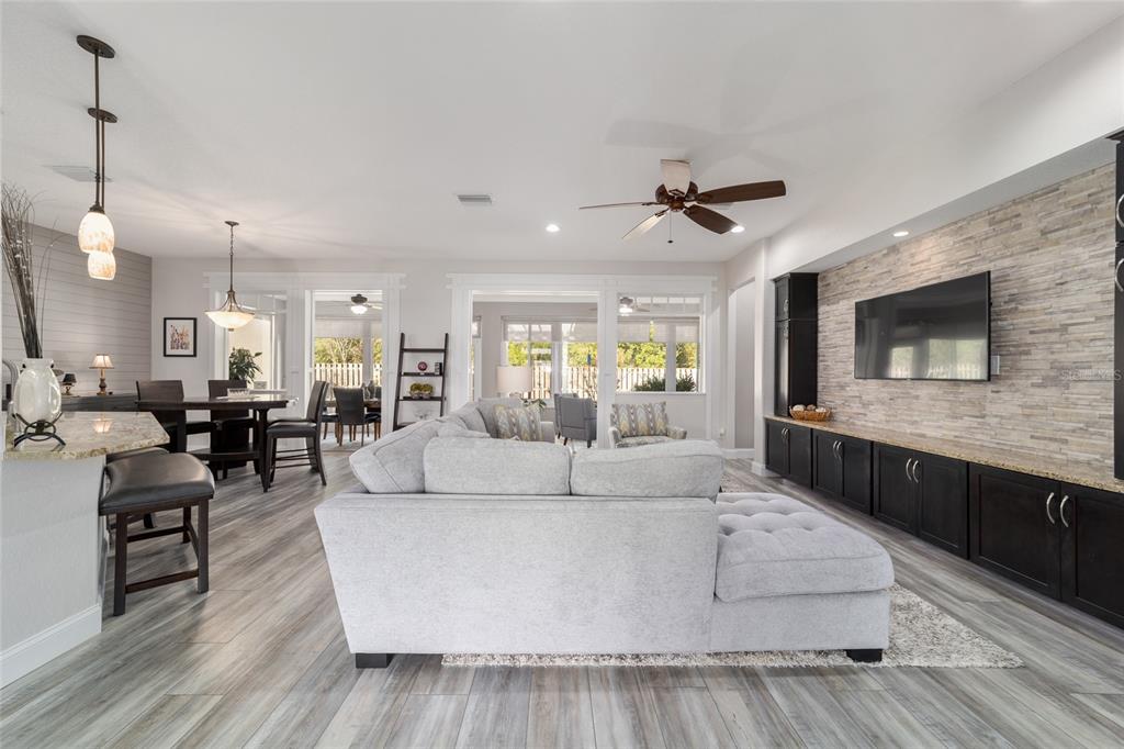 11888 Southeast 91st Circle Summerfield, FL 34491 - Photo 13 of 67 a living room with furniture and a flat screen tv