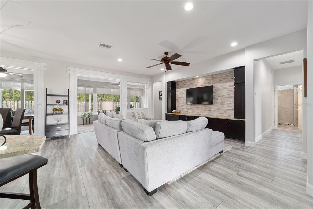 11888 Southeast 91st Circle Summerfield, FL 34491 - Photo 14 of 67 a living room with furniture and a flat screen tv