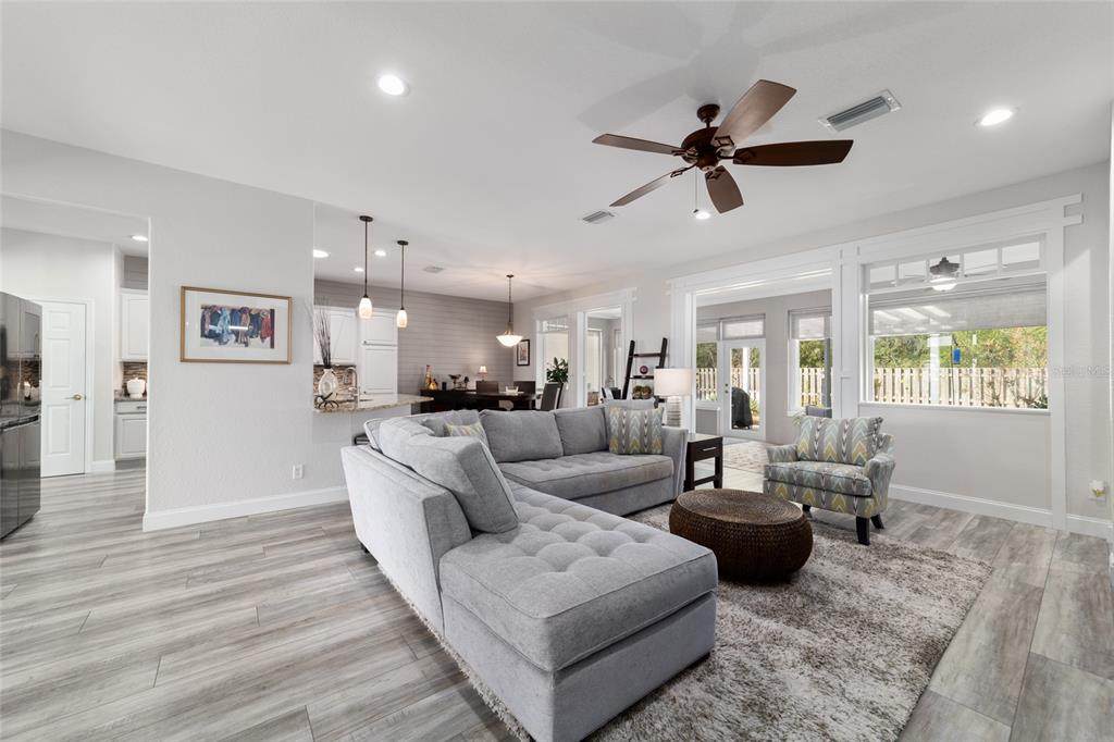 11888 Southeast 91st Circle Summerfield, FL 34491 - Photo 16 of 67 a living room with furniture and a large window