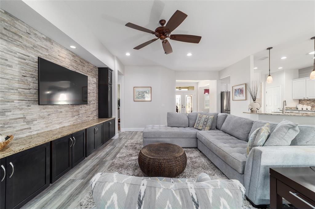 11888 Southeast 91st Circle Summerfield, FL 34491 - Photo 19 of 67 a living room with furniture and a flat screen tv