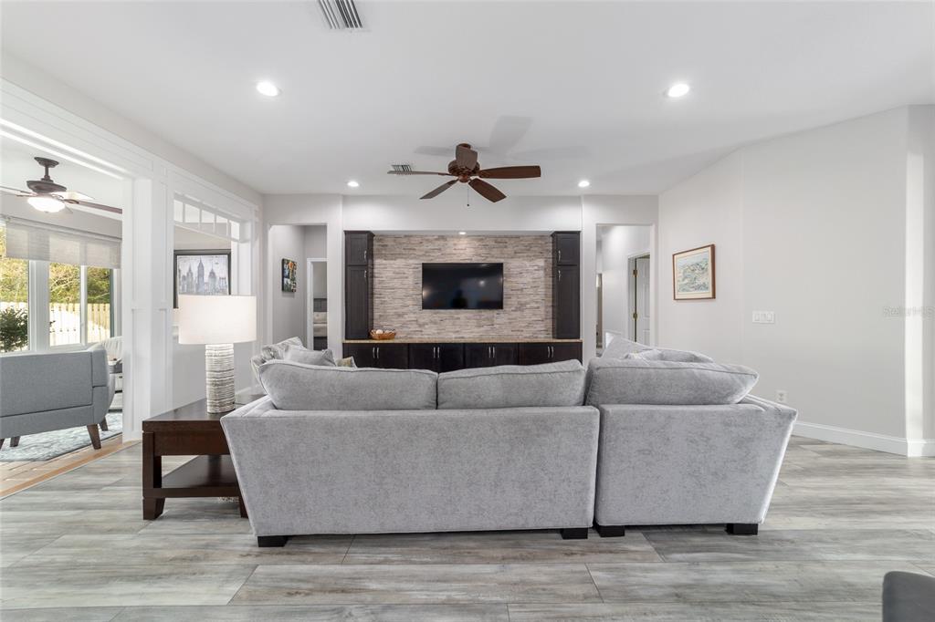 11888 Southeast 91st Circle Summerfield, FL 34491 - Photo 21 of 67 a living room with furniture and a fireplace
