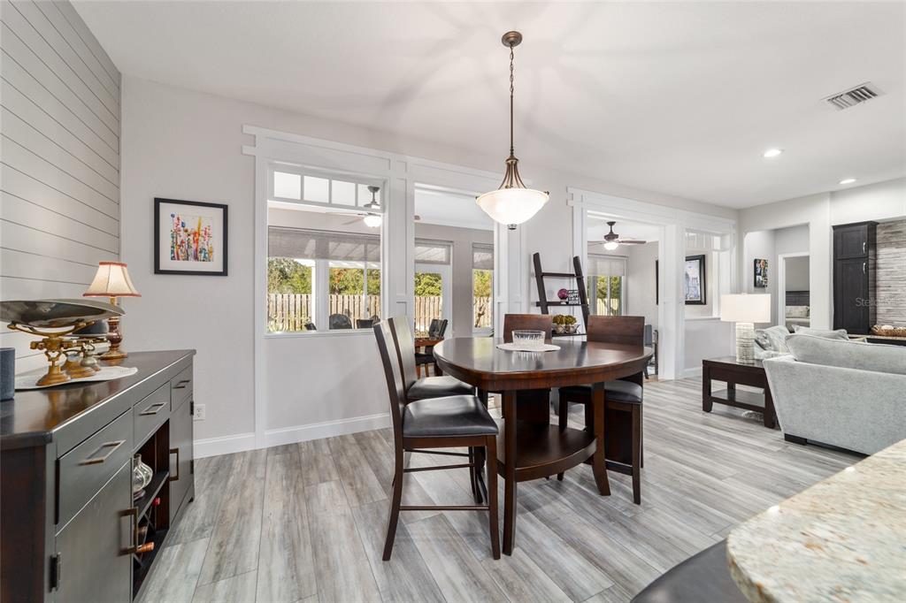 11888 Southeast 91st Circle Summerfield, FL 34491 - Photo 26 of 67 a view of a dining room with furniture window and wooden floor