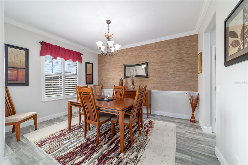 11888 Southeast 91st Circle Summerfield, FL 34491 - Photo 35 of 67 a view of a dining room with furniture window and wooden floor