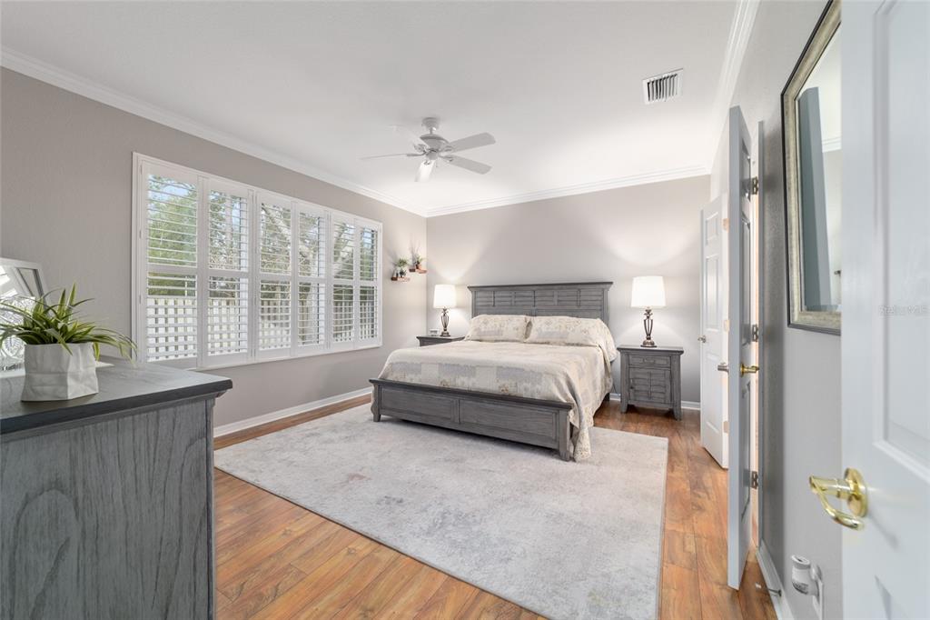 11888 Southeast 91st Circle Summerfield, FL 34491 - Photo 36 of 67 a bedroom with a bed and a window