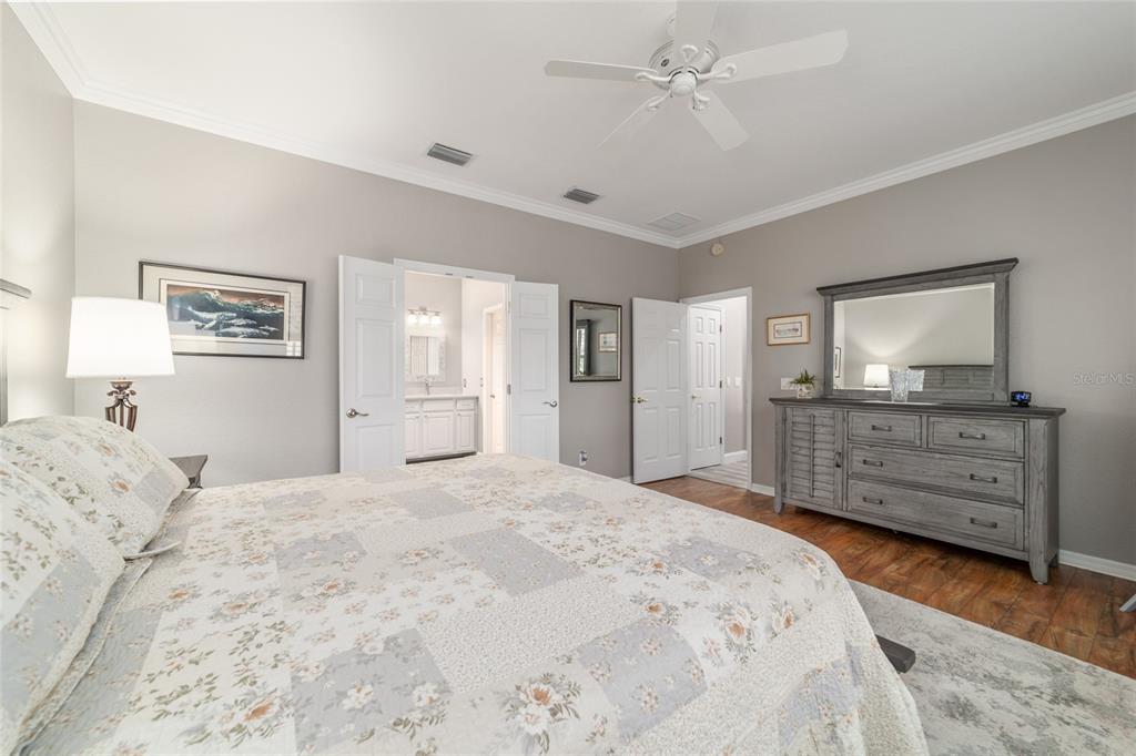 11888 Southeast 91st Circle Summerfield, FL 34491 - Photo 38 of 67 a bedroom with a bed and a dresser