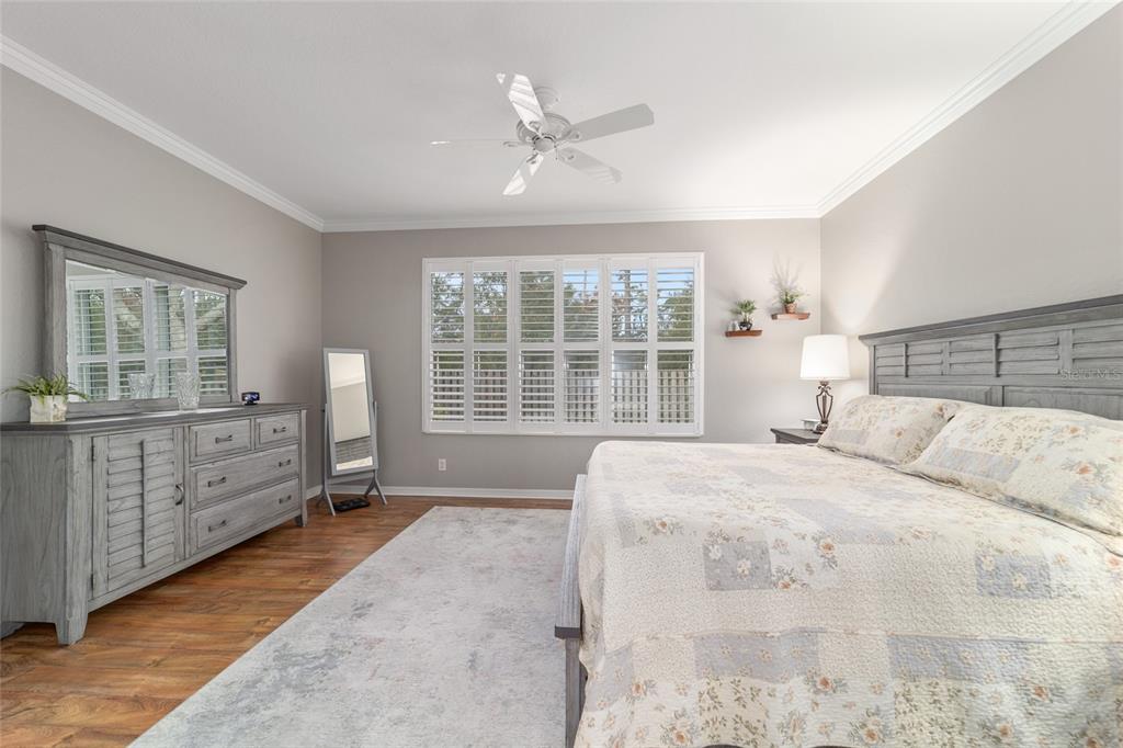 11888 Southeast 91st Circle Summerfield, FL 34491 - Photo 39 of 67 a bedroom with a large bed and a window