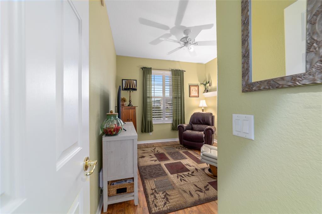 11888 Southeast 91st Circle Summerfield, FL 34491 - Photo 46 of 67 a living room with furniture and a chandelier