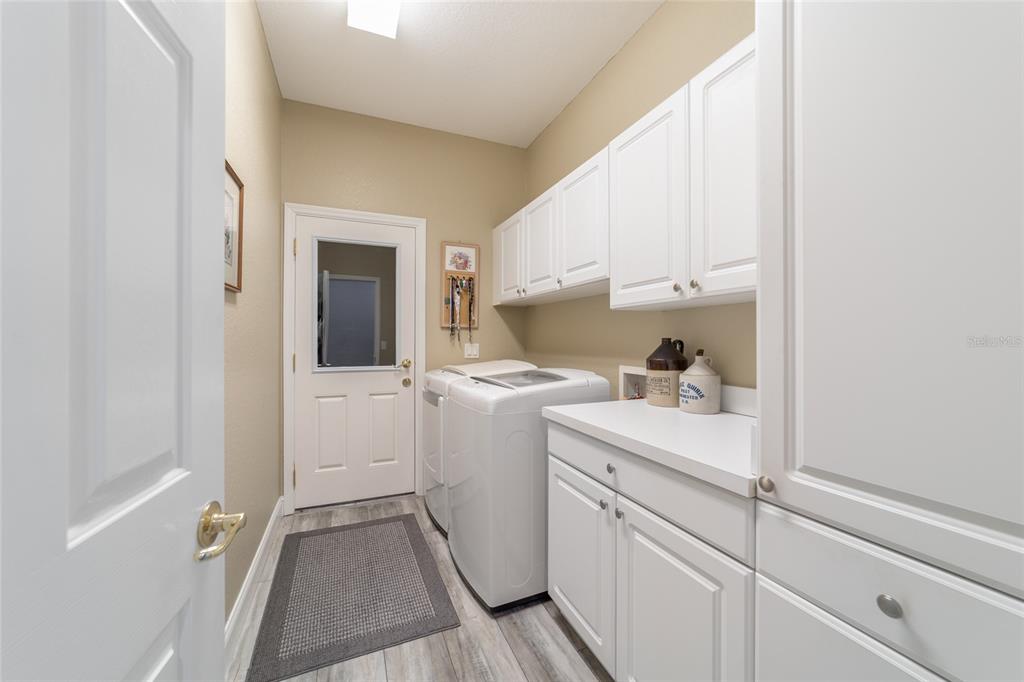 11888 Southeast 91st Circle Summerfield, FL 34491 - Photo 49 of 67 a storage room with a washer and dryer