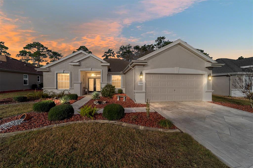 11888 Southeast 91st Circle Summerfield, FL 34491 - Photo 6 of 67 a view of a front of a house with a yard