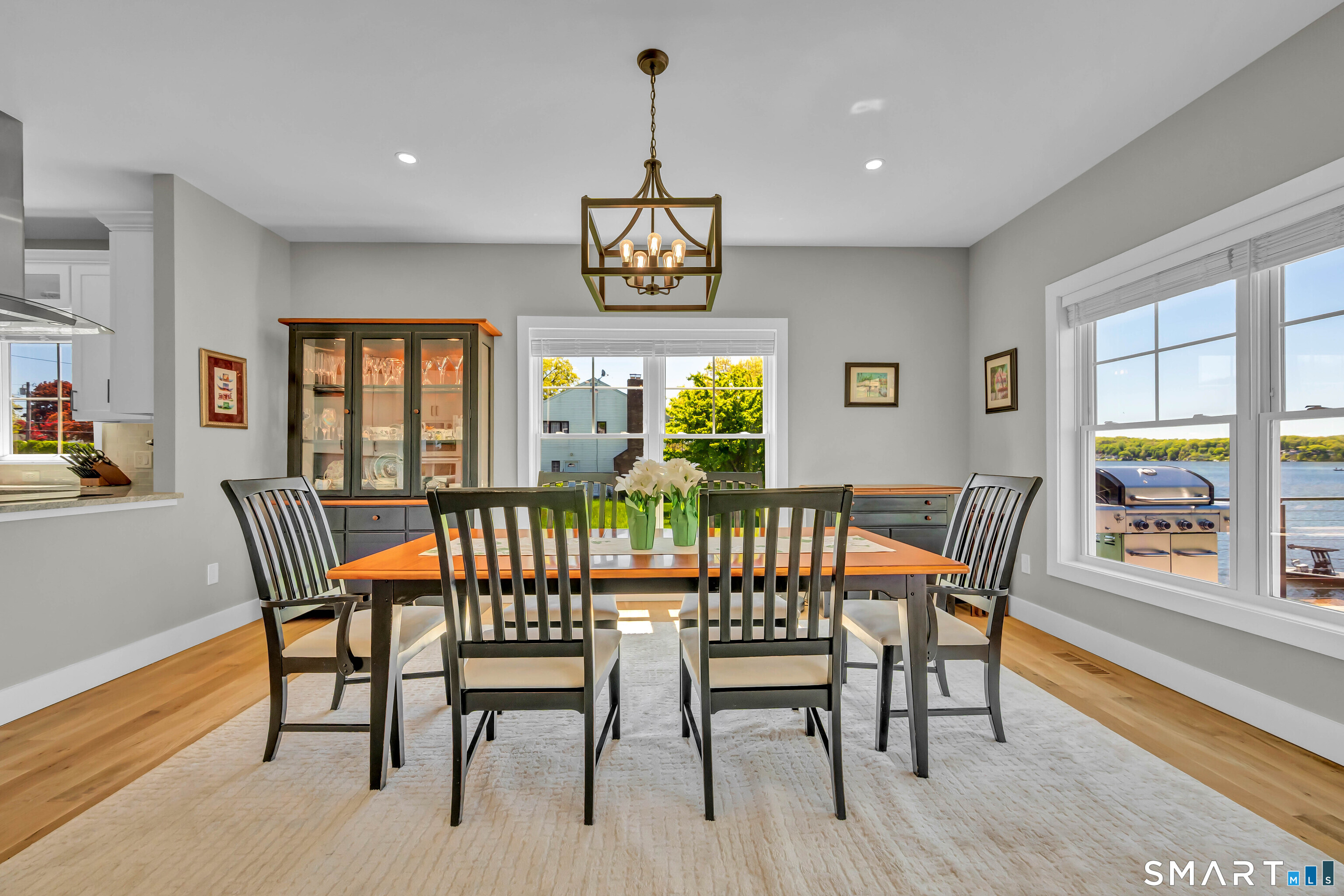 21 Lakeview Road Brookfield, CT 06804 - Photo 13 of 39 a dining room with furniture a rug a potted plant and wooden floor