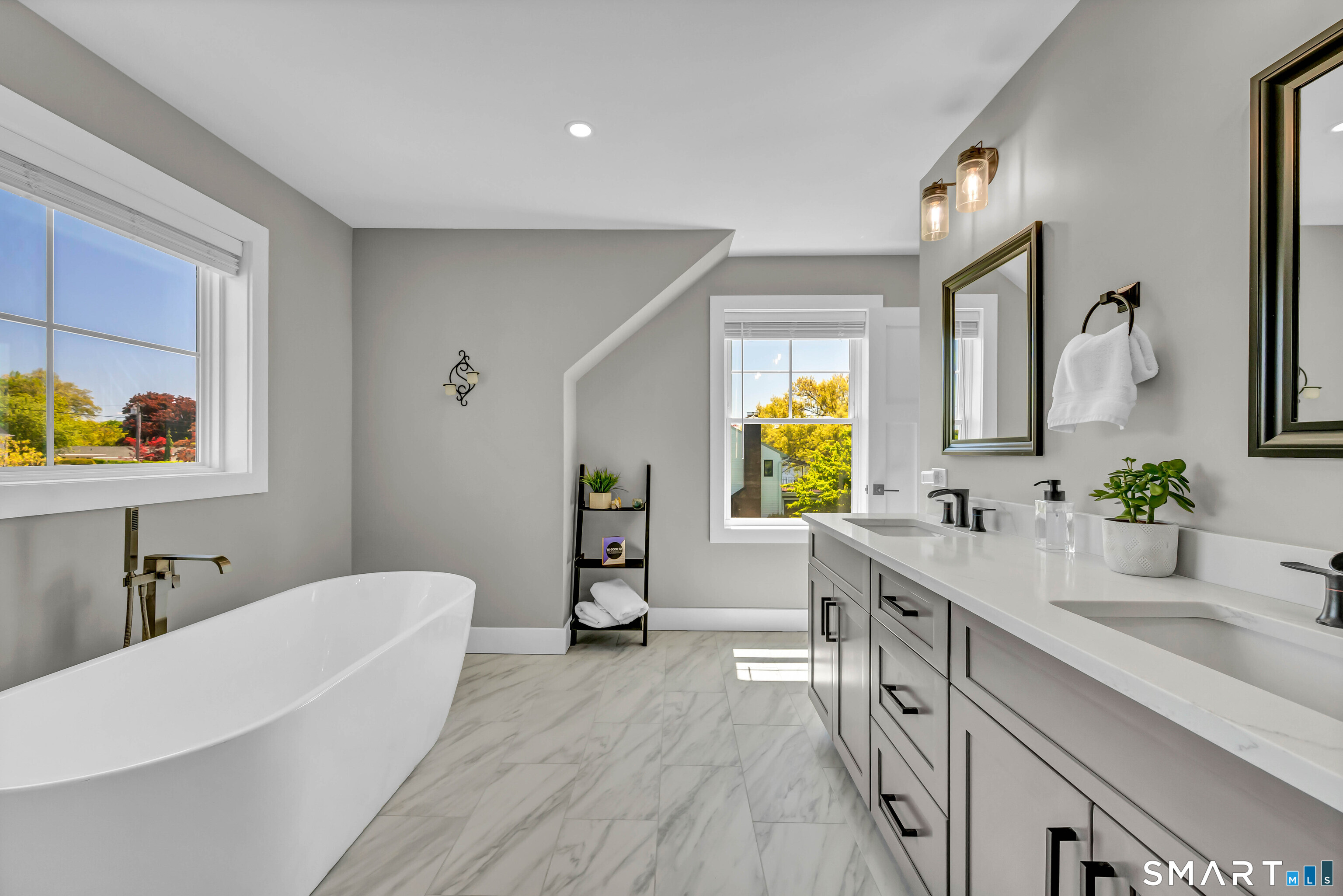 21 Lakeview Road Brookfield, CT 06804 - Photo 26 of 39 a spacious bathroom with a double vanity sink a mirror a bathtub and window