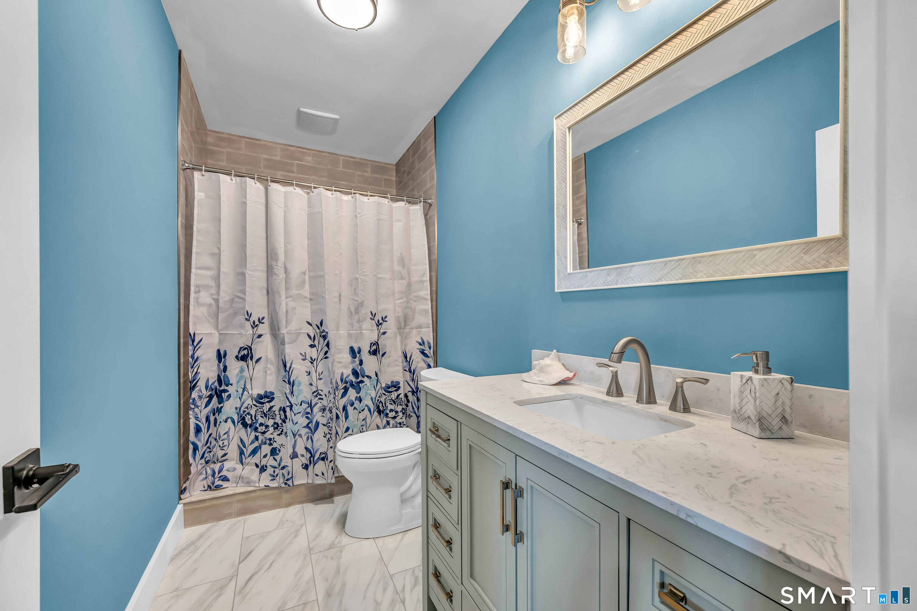 21 Lakeview Road Brookfield, CT 06804 - Photo 36 of 39 a bathroom with a sink a toilet and a mirror