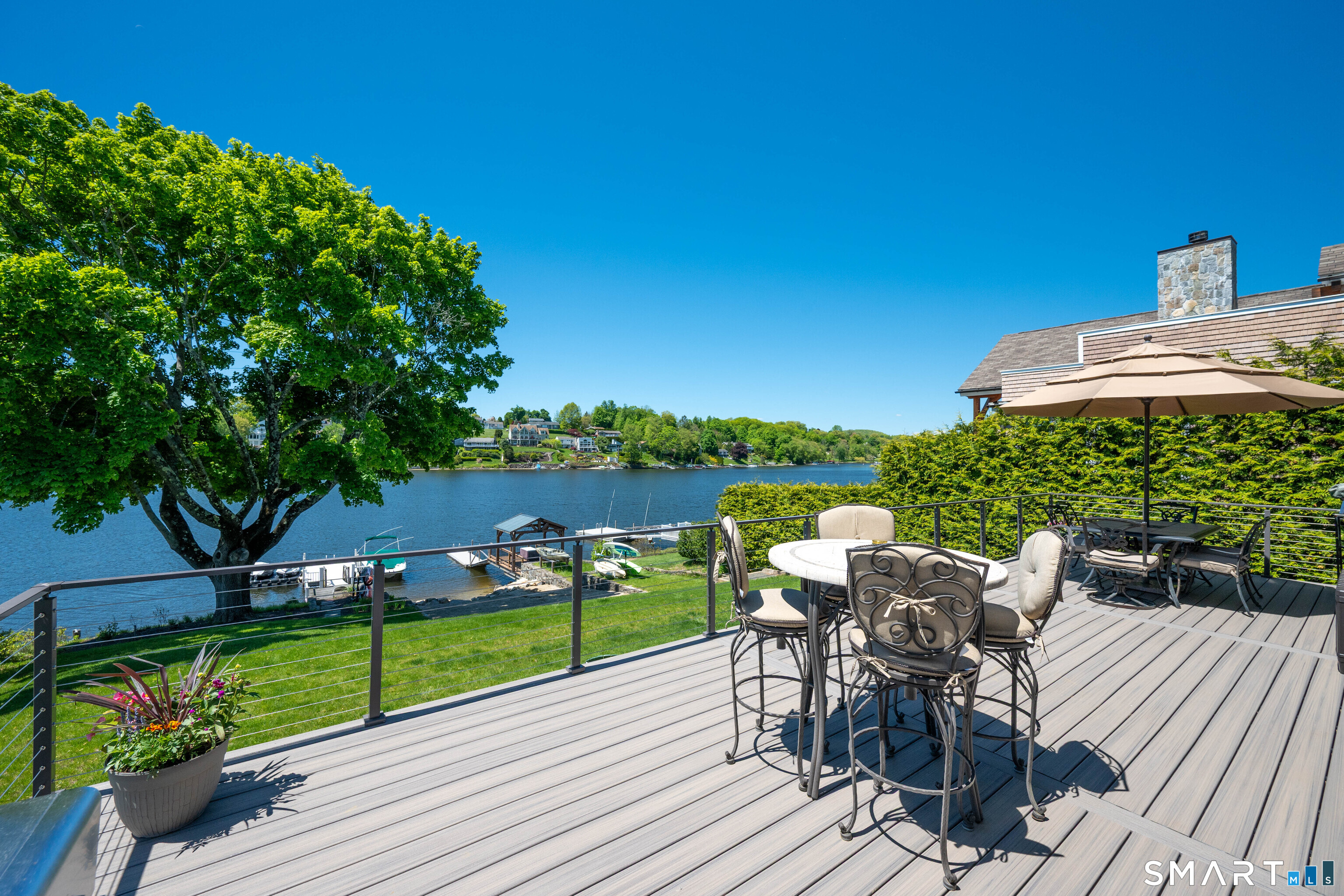 21 Lakeview Road Brookfield, CT 06804 - Photo 37 of 39 a view of a chairs and table in patio with a lake view