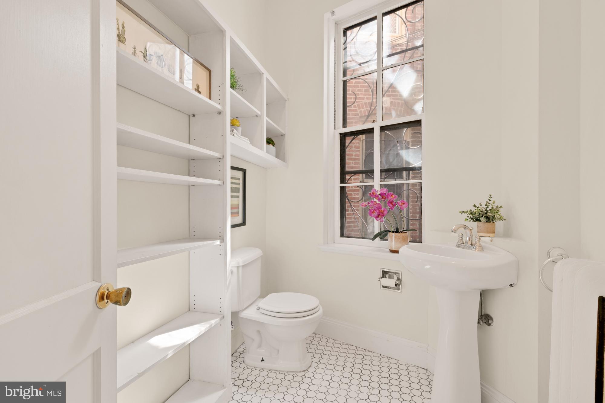 2133 Bolton Street Baltimore, MD 21217 - Photo 12 of 53 a bathroom with a toilet sink and shower