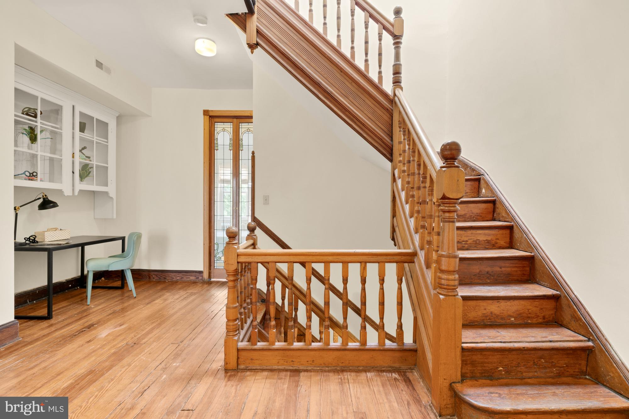 2133 Bolton Street Baltimore, MD 21217 - Photo 18 of 53 a view of entryway dining room and hall with wooden floor