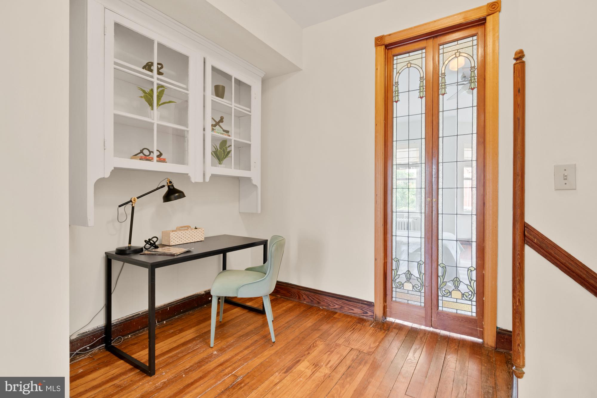 2133 Bolton Street Baltimore, MD 21217 - Photo 19 of 53 a view of a workspace with furniture and a window
