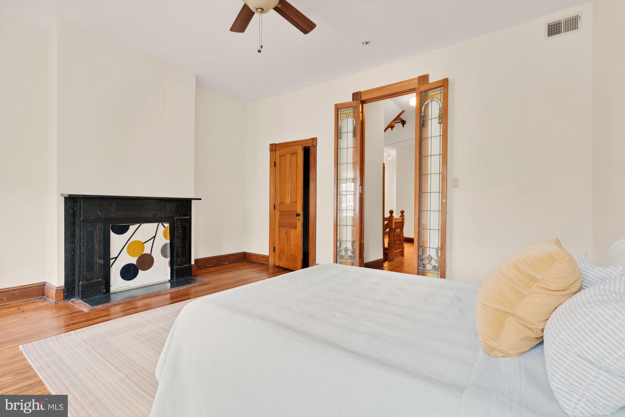 2133 Bolton Street Baltimore, MD 21217 - Photo 23 of 53 a bed room with a bed and a fireplace