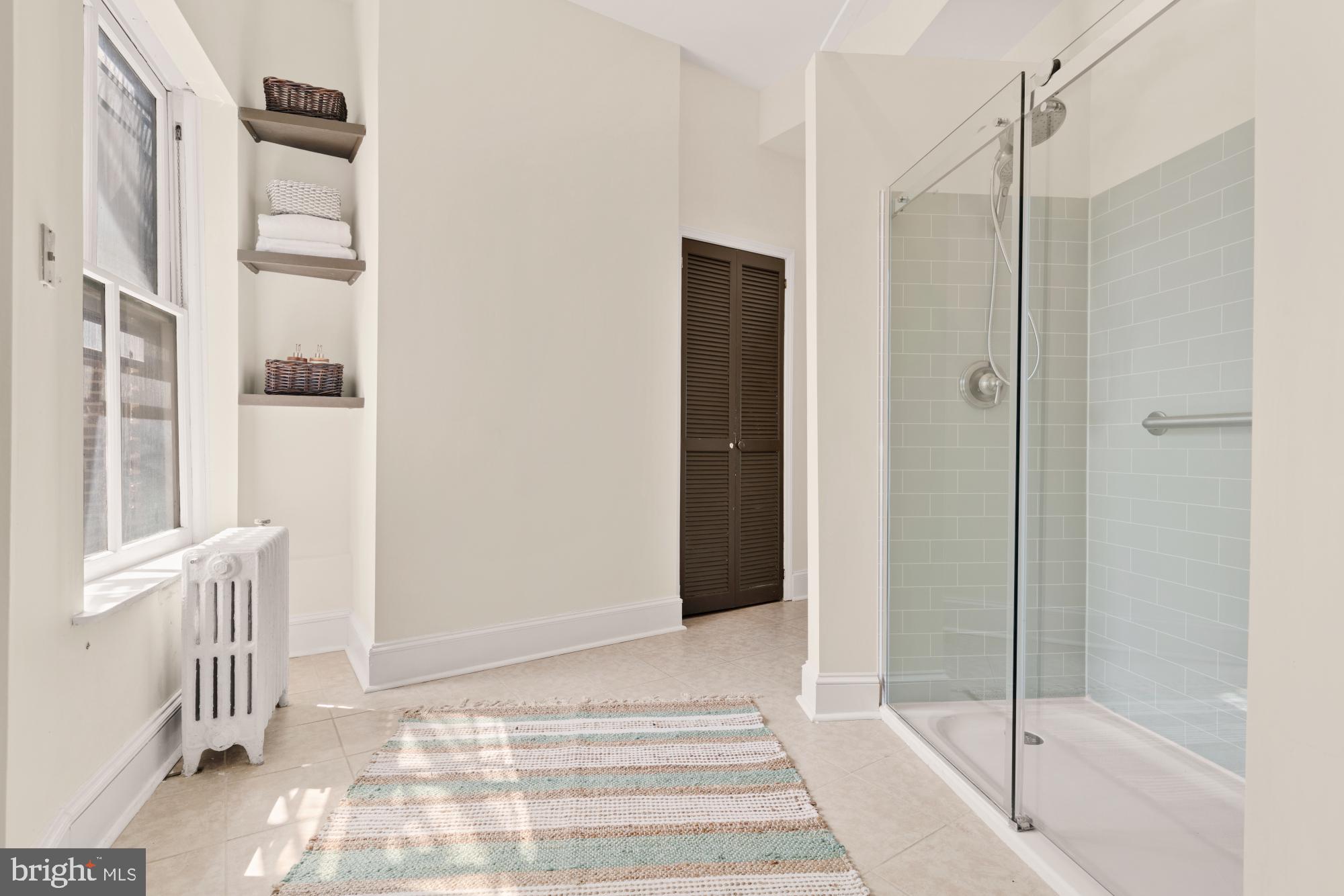 2133 Bolton Street Baltimore, MD 21217 - Photo 24 of 53 a view of a bathroom with a tub and shower