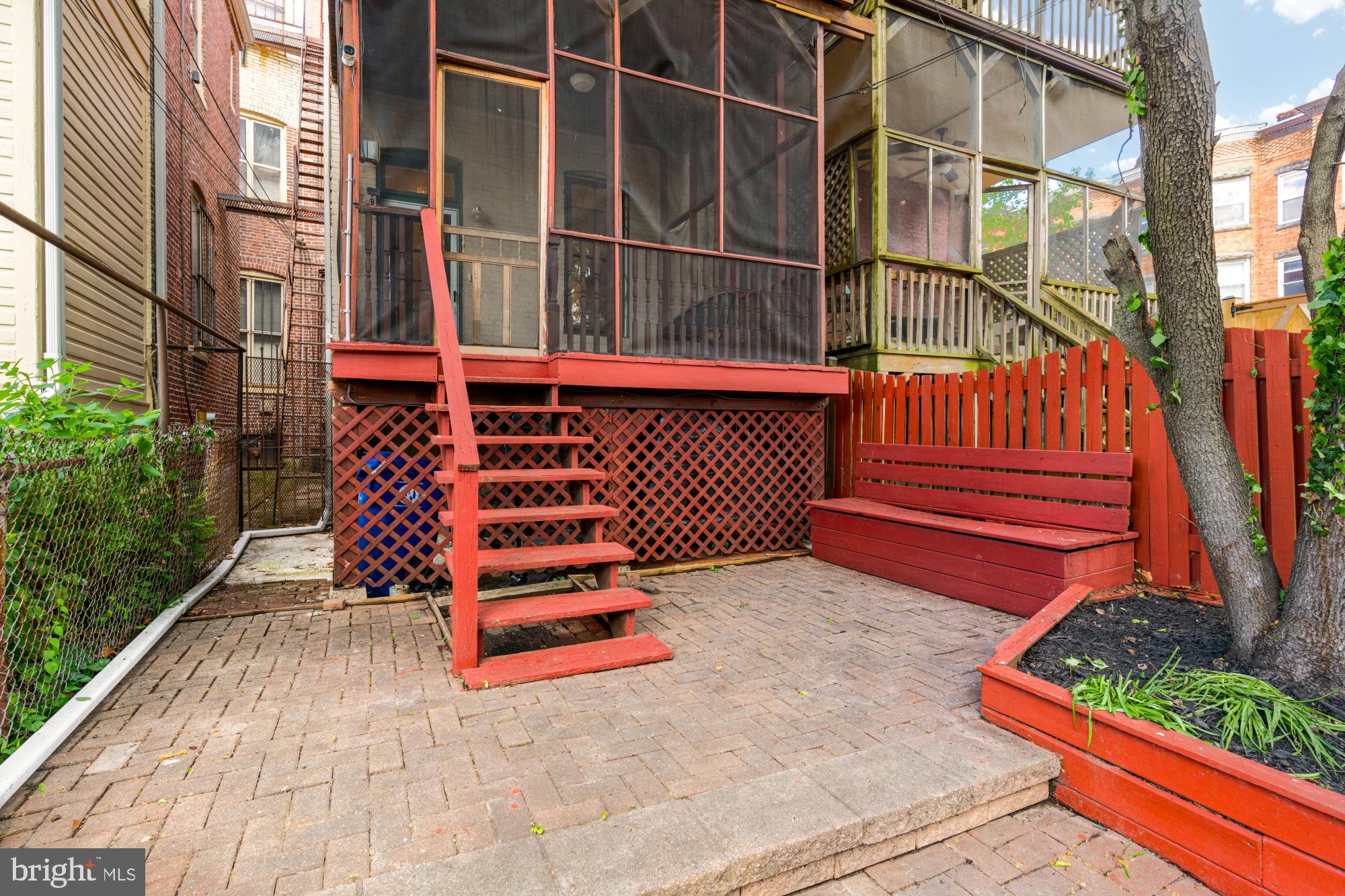 2133 Bolton Street Baltimore, MD 21217 - Photo 43 of 53 front view of a house with a small yard