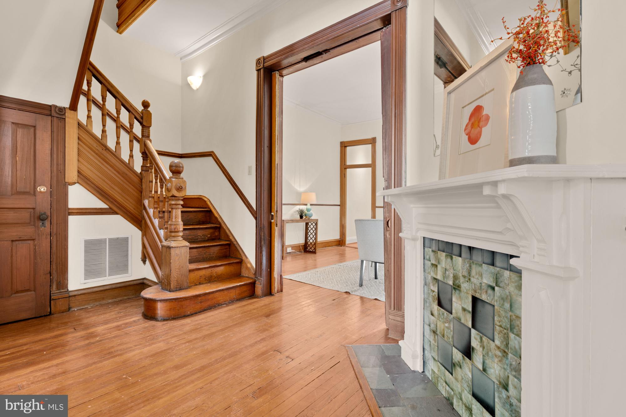 2133 Bolton Street Baltimore, MD 21217 - Photo 8 of 53 a view of entryway and hall with wooden floor