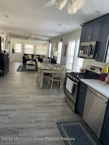 a living room with furniture wooden floor and a fireplace