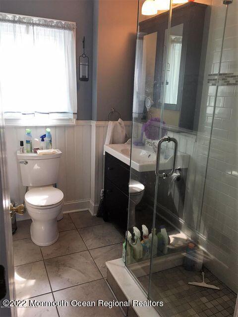 111 Guyer Avenue, Unit DOWN Lavallette, NJ 08735 - Photo 13 of 21 a bathroom with a toilet a sink and a mirror