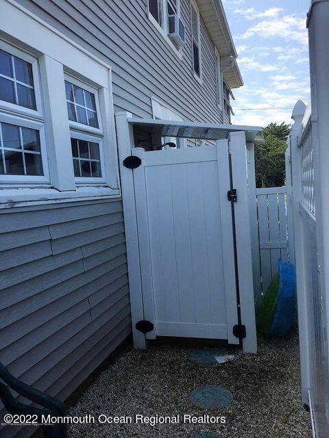 111 Guyer Avenue, Unit DOWN Lavallette, NJ 08735 - Photo 21 of 21 a view of a house with a window and wooden fence
