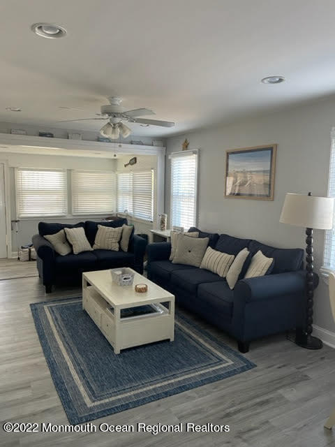 111 Guyer Avenue, Unit DOWN Lavallette, NJ 08735 - Photo 5 of 21 a living room with furniture and a large window