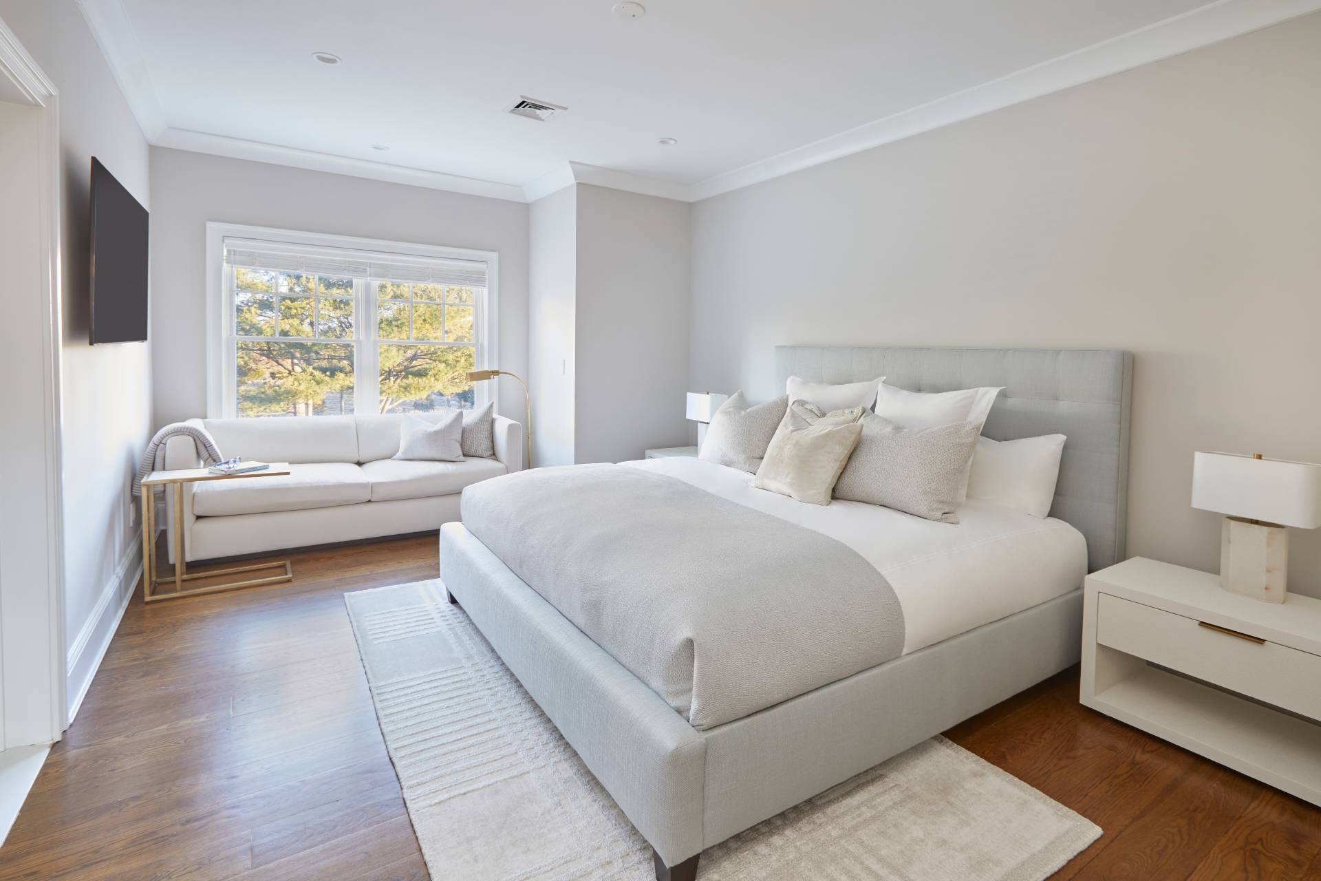 495 Scuttle Hole Road Water Mill, NY 11976 - Photo 16 of 29 a bedroom with a bed and a couch