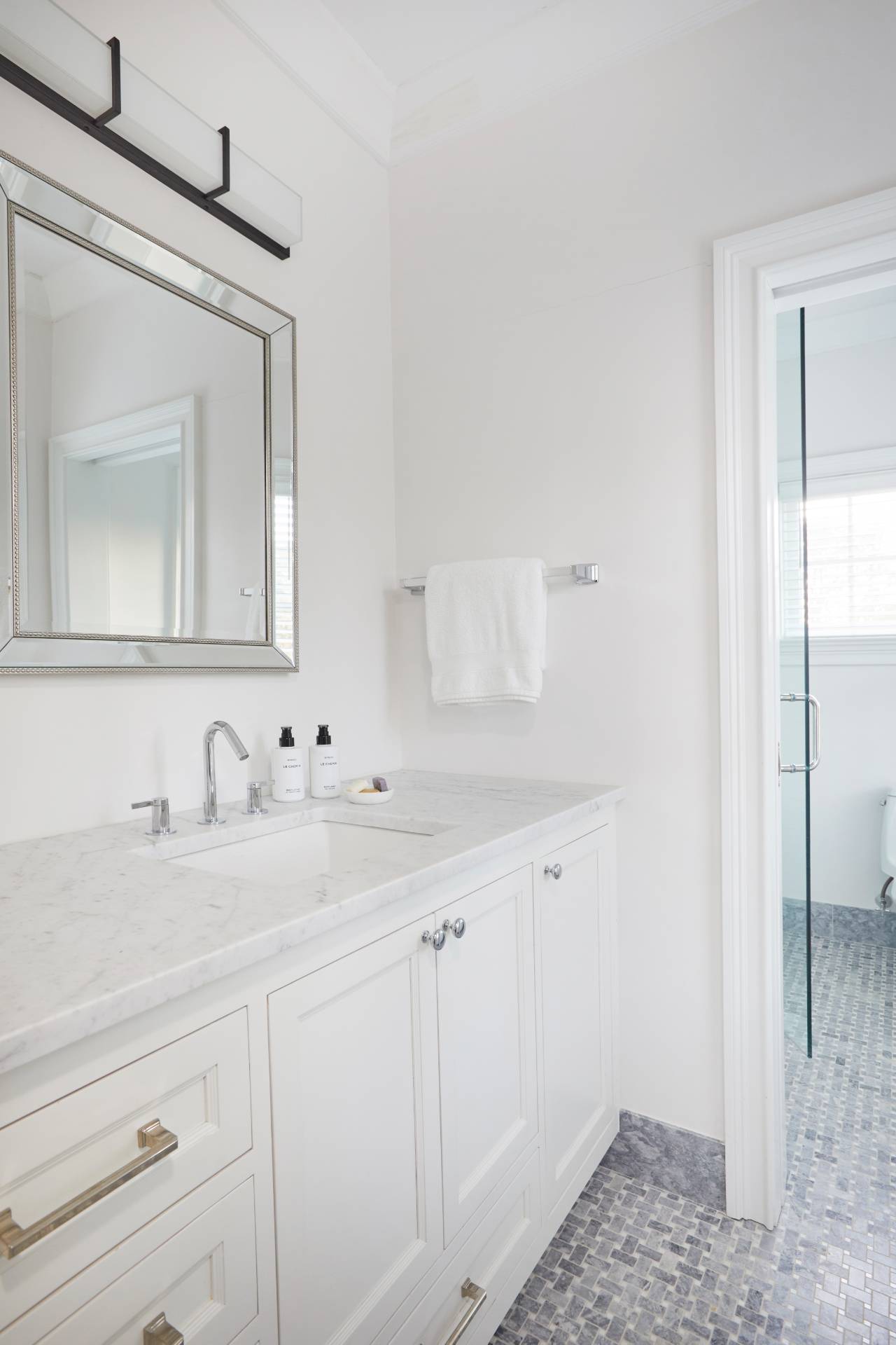 495 Scuttle Hole Road Water Mill, NY 11976 - Photo 19 of 29 a bathroom with a sink and a mirror