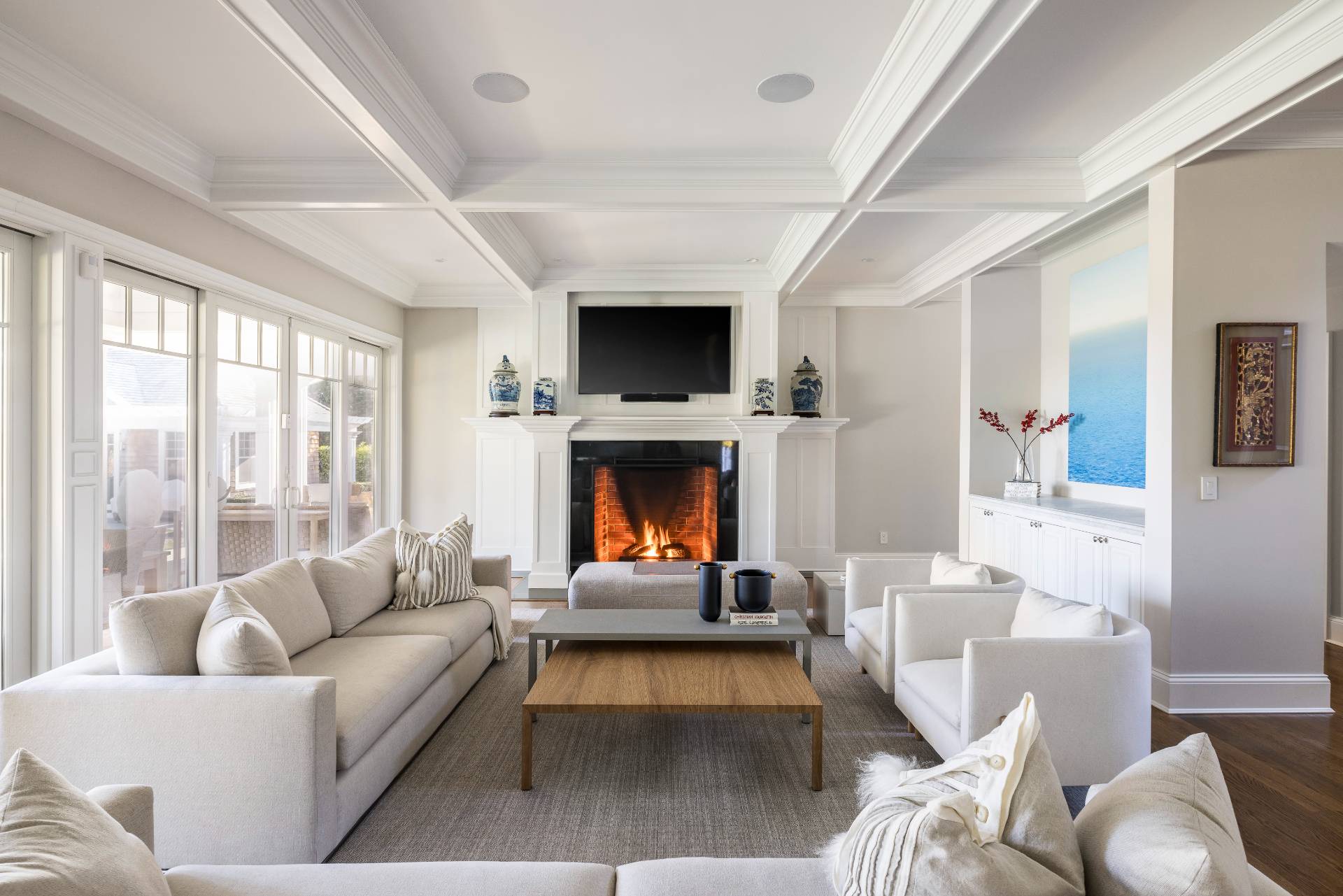 495 Scuttle Hole Road Water Mill, NY 11976 - Photo 4 of 29 a living room with furniture a flat screen tv and a fireplace