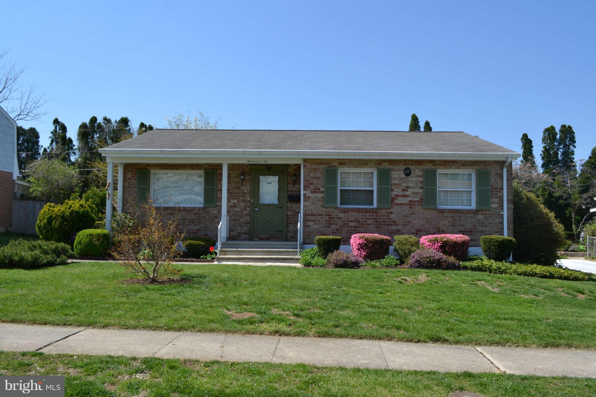 1406 Woodbridge Road Baltimore, MD 21228 - Photo 1 of 18 a front view of house with yard