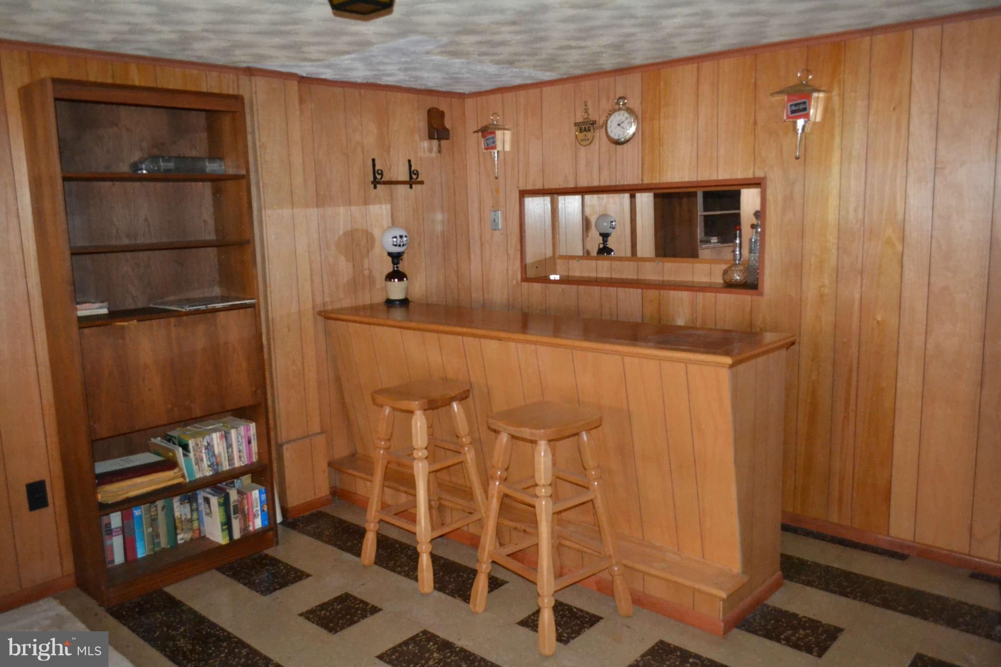 1406 Woodbridge Road Baltimore, MD 21228 - Photo 15 of 18 a view of a refrigerator and a table in a room