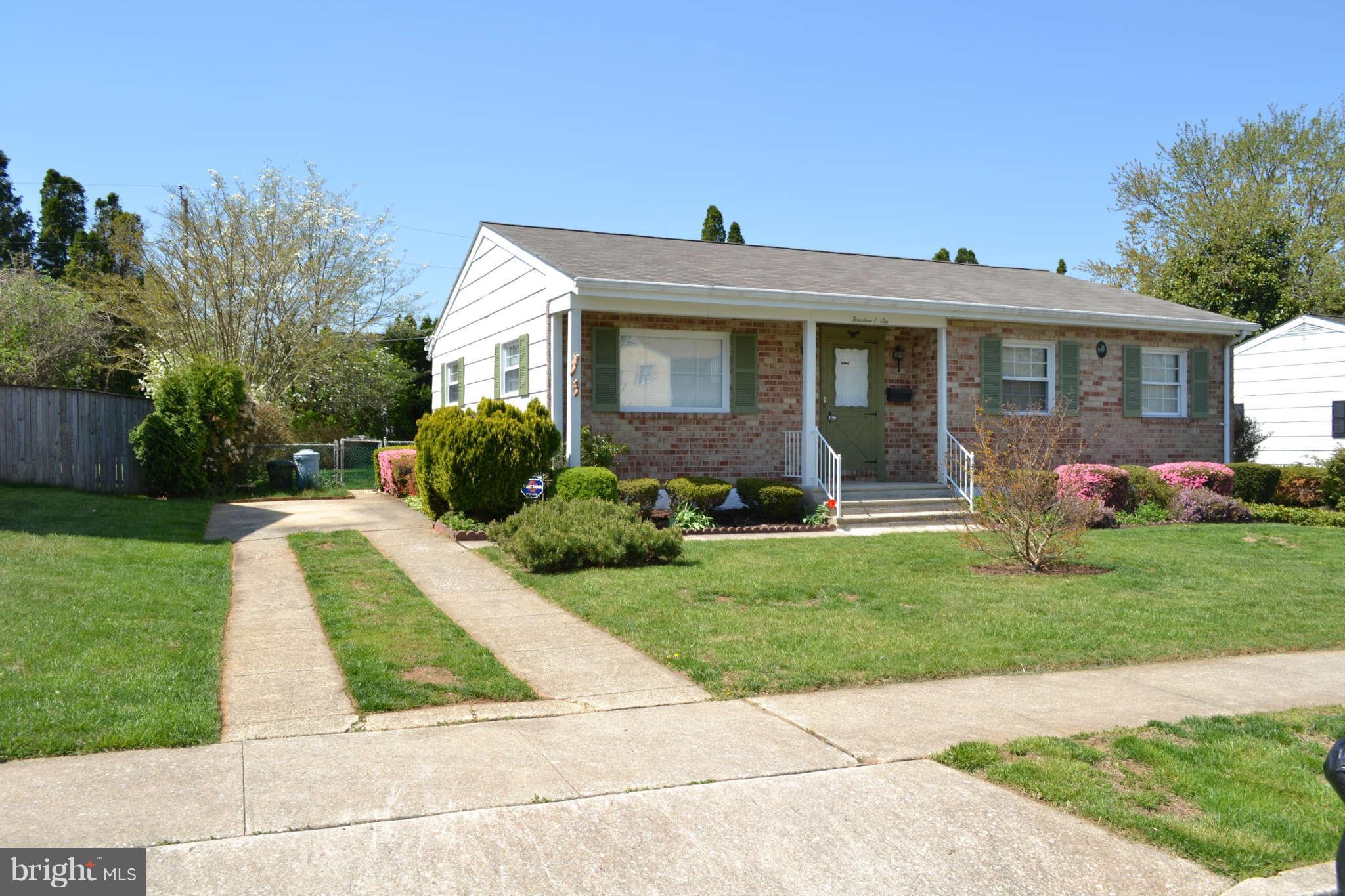 1406 Woodbridge Road Baltimore, MD 21228 - Photo 16 of 18 a front view of house with yard