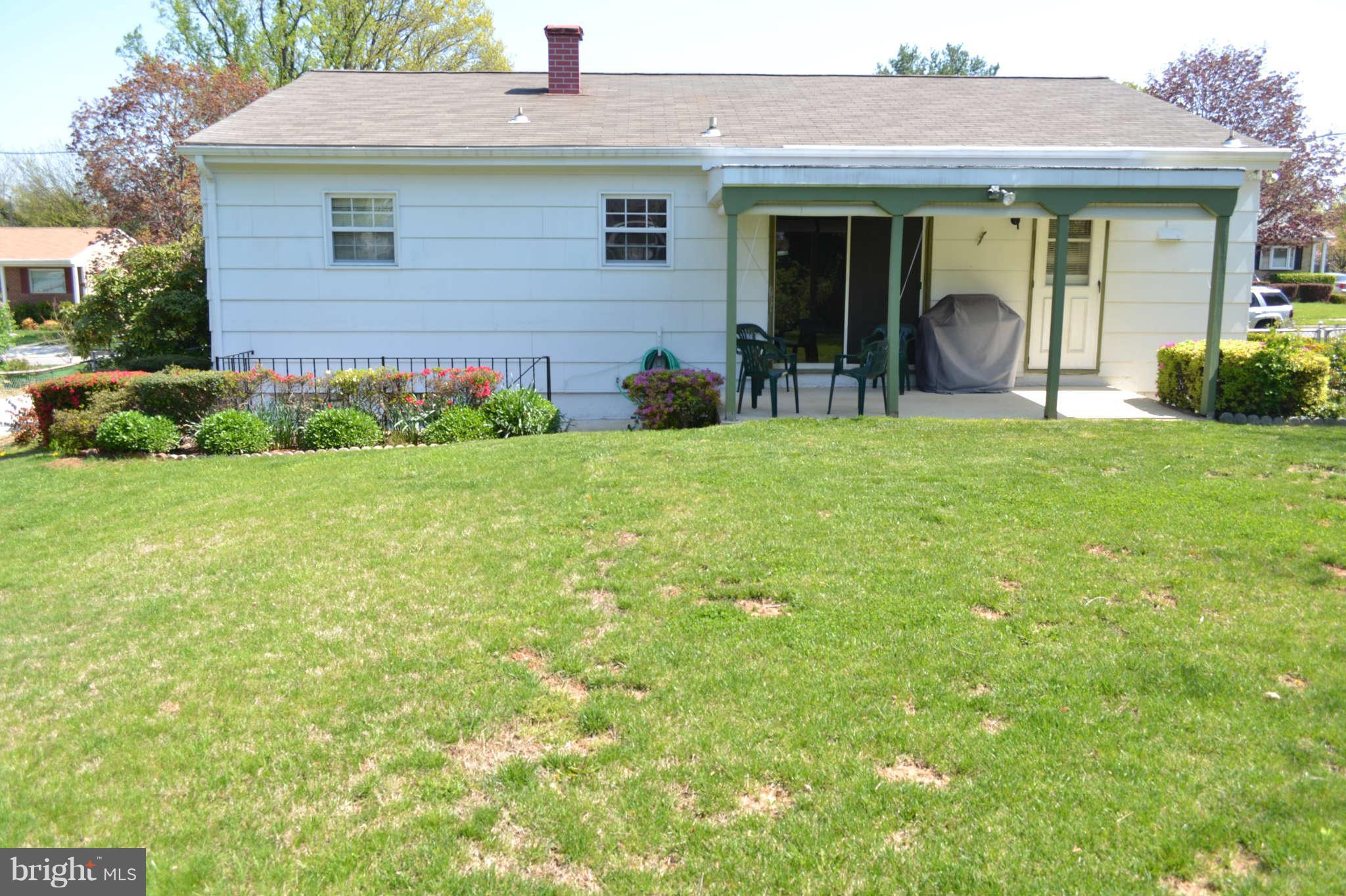 1406 Woodbridge Road Baltimore, MD 21228 - Photo 17 of 18 a view of a house with backyard and garden