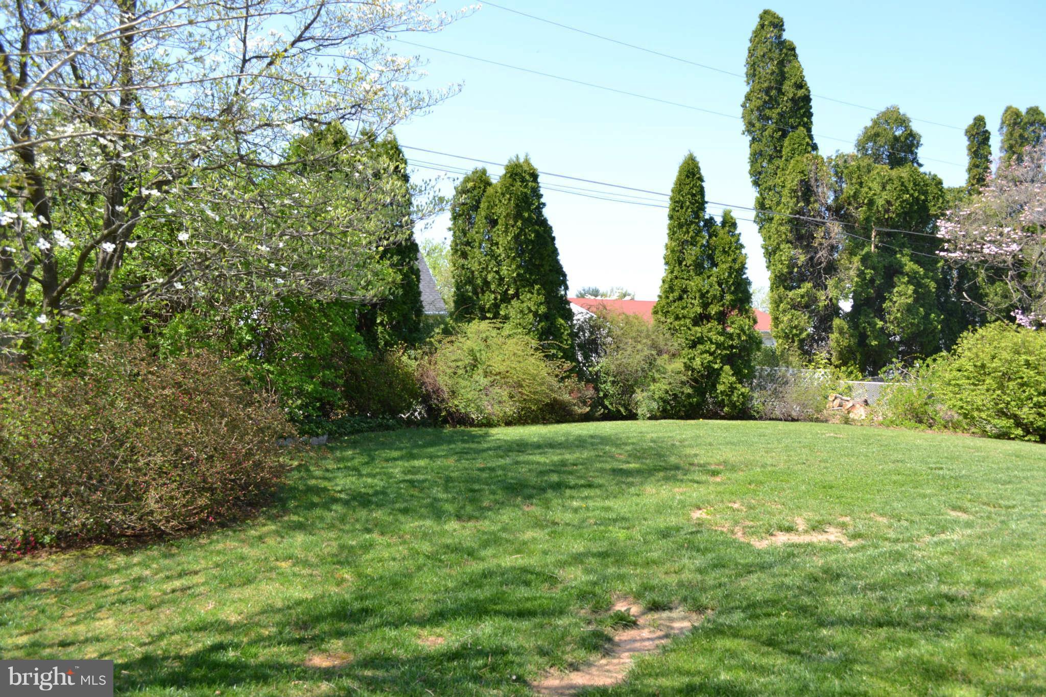 1406 Woodbridge Road Baltimore, MD 21228 - Photo 18 of 18 a view of a field of grass and trees