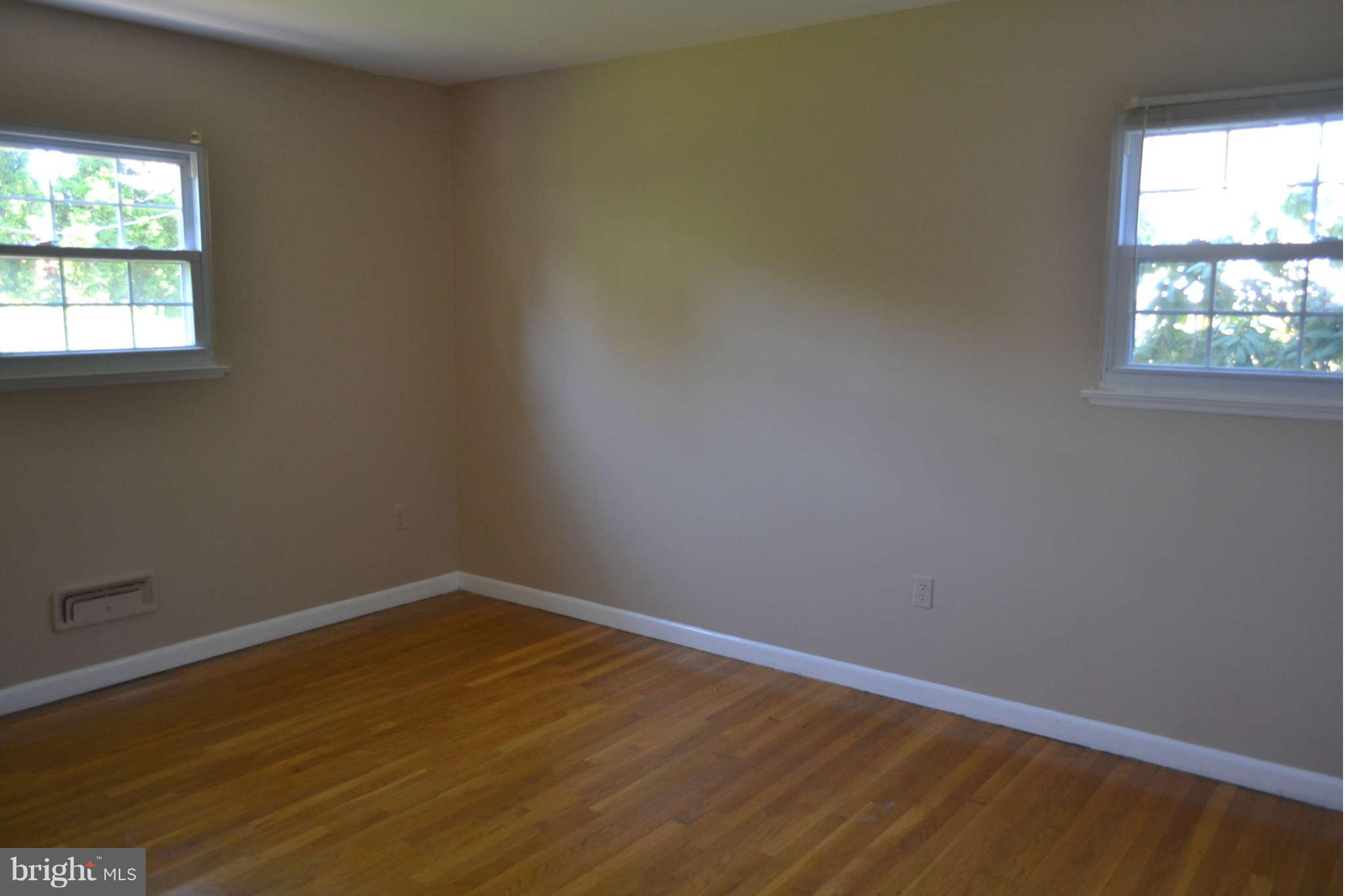 1406 Woodbridge Road Baltimore, MD 21228 - Photo 7 of 18 an empty room with a window