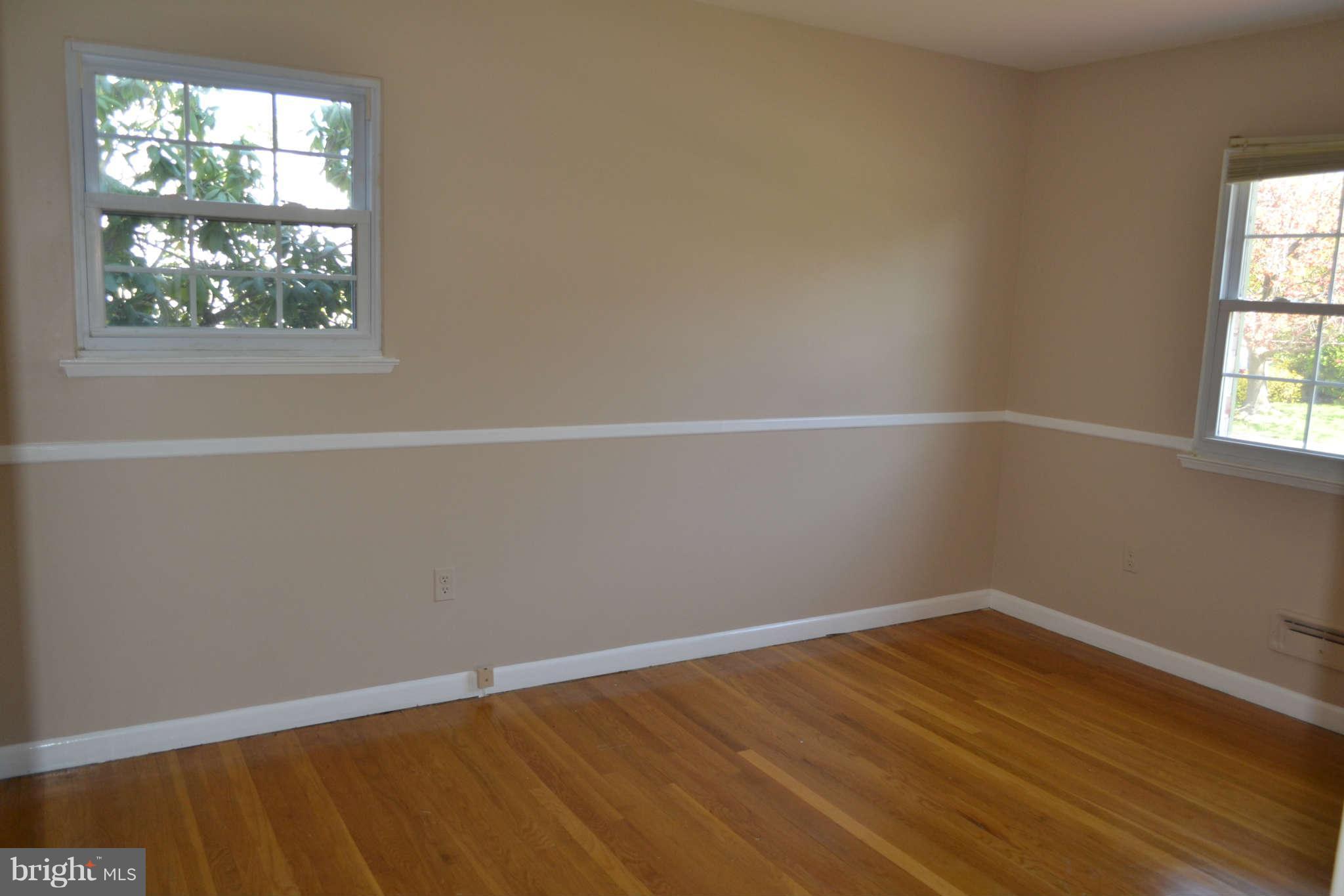 1406 Woodbridge Road Baltimore, MD 21228 - Photo 9 of 18 an empty room with a window