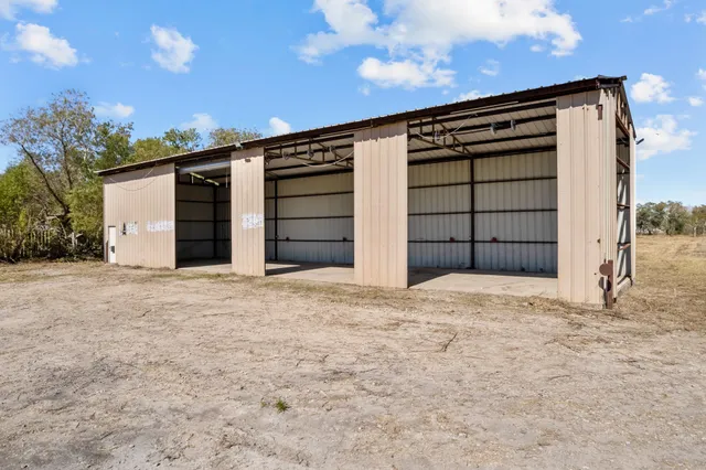 a view of a house with a yard and garage