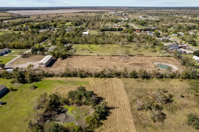 an aerial view of residential house with outdoor space