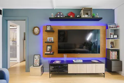 a living room with furniture and a flat screen tv