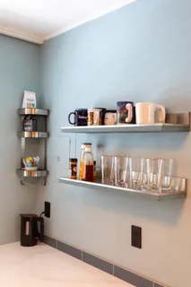 a shelf with books and knick knacks on it