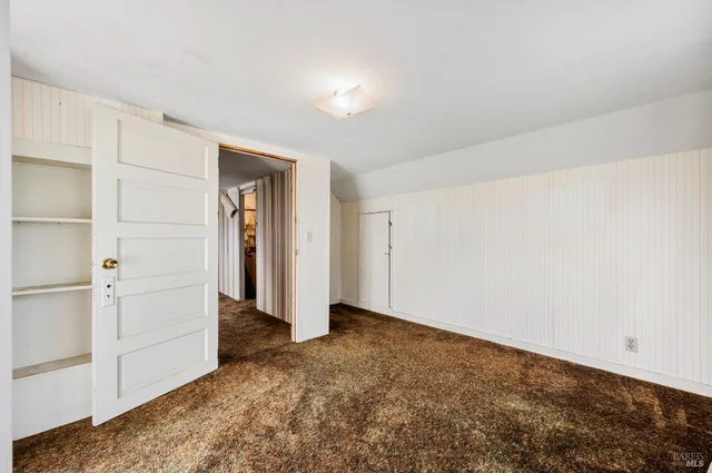 a balcony with furniture and wooden floor