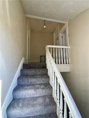 a kitchen with sink cabinets and wooden floor