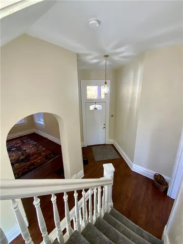 a view of kitchen with furniture and wooden floor