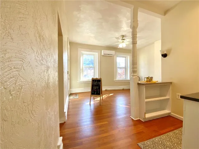 a view of entryway with wooden floor