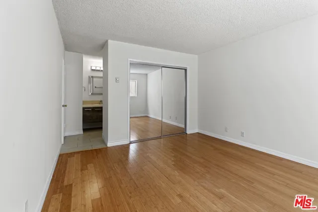 a view of wooden floor in an empty room