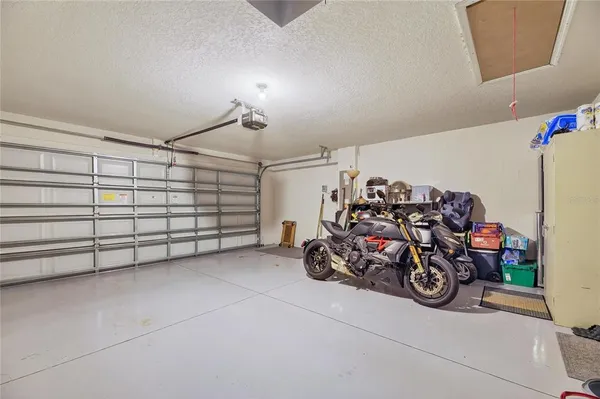 a view of a garage with a bike and car