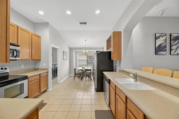 a kitchen with a sink cabinets and appliances