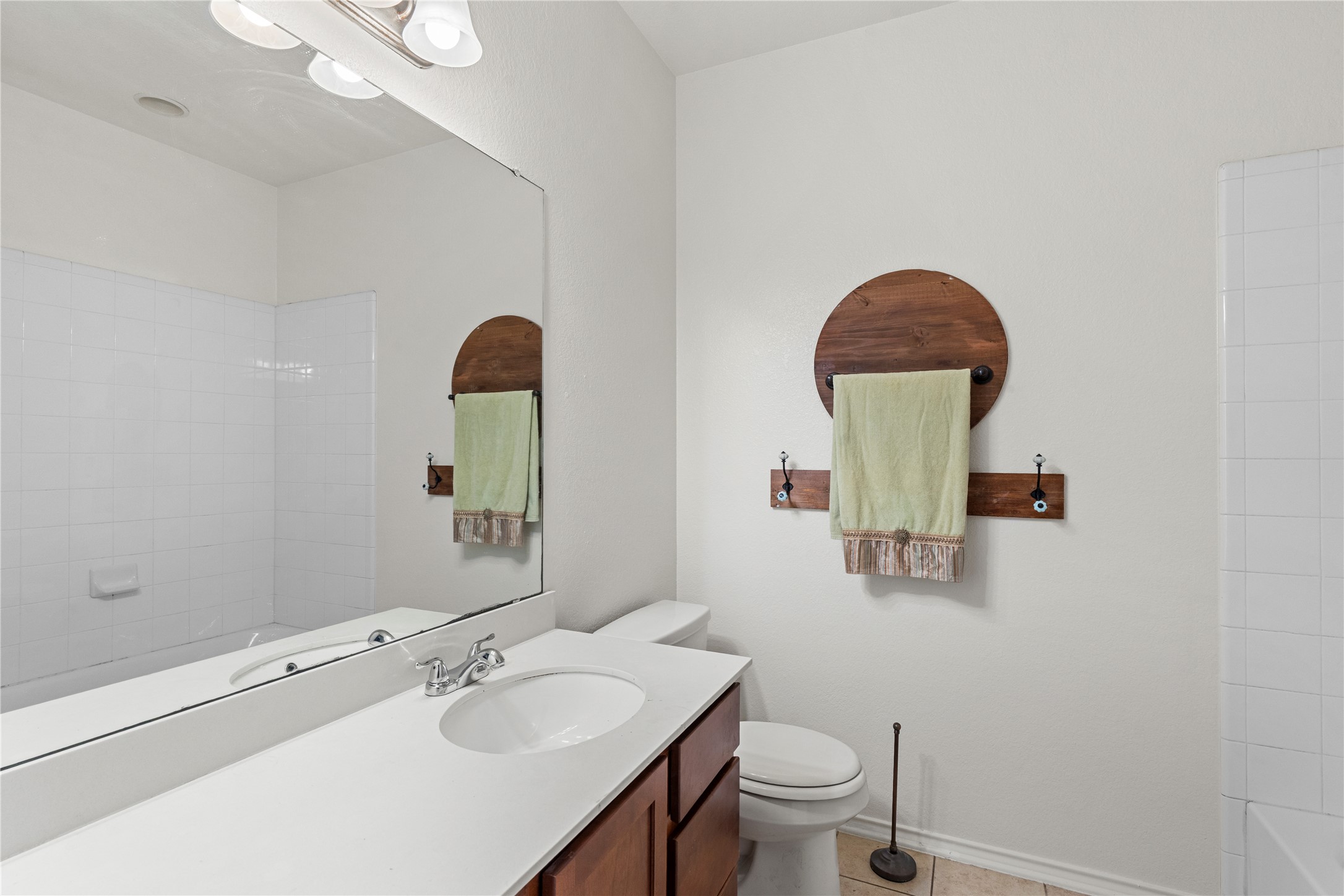 8613 Capitol View Drive Austin, TX 78747 - Photo 6 of 33 A well-appointed bath features a spacious vanity with an integrated sink and abundant mirror.
